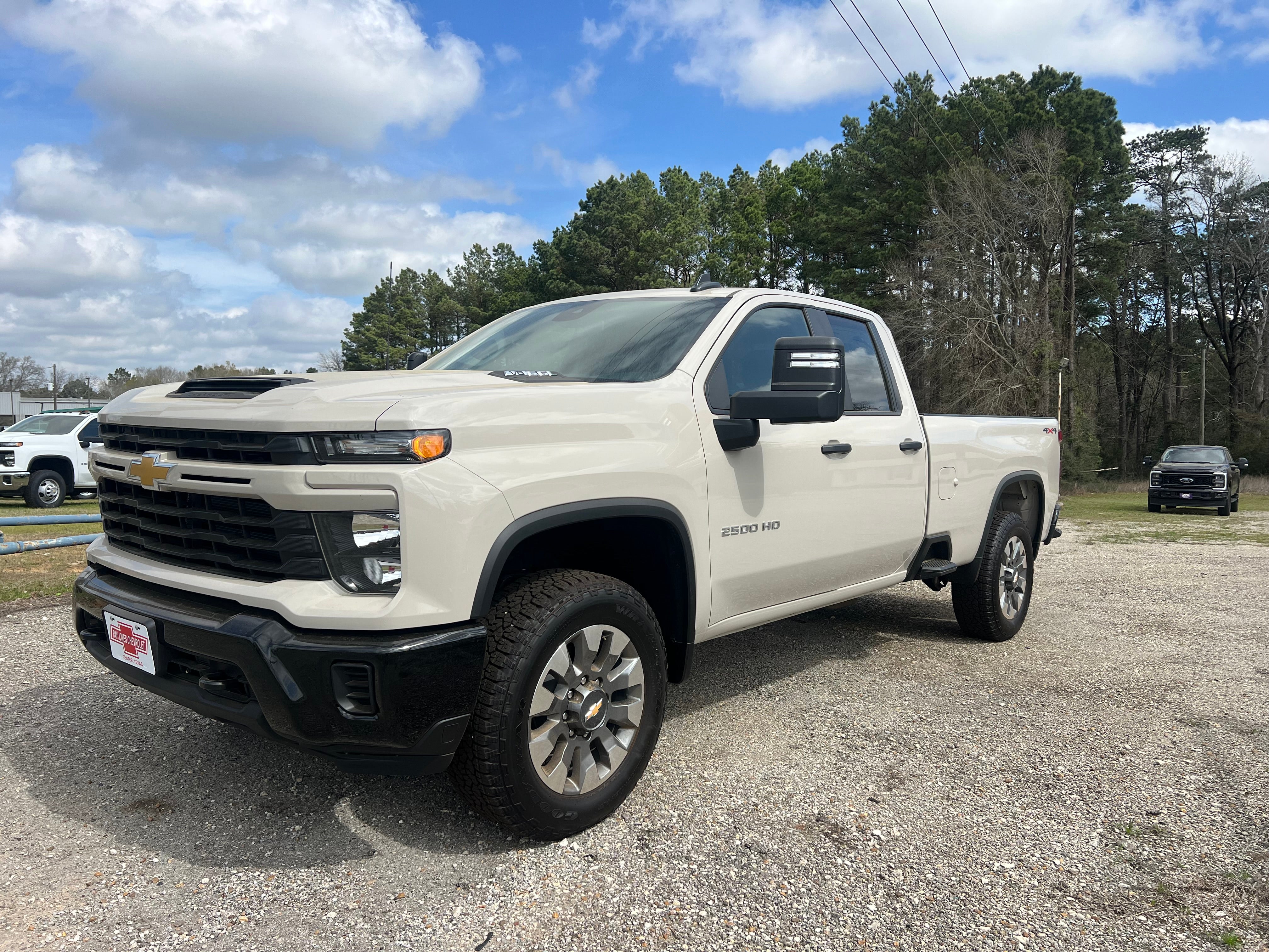 2026 Chevrolet Silverado 2500 HD Custom in White Sands — front three-quarter view