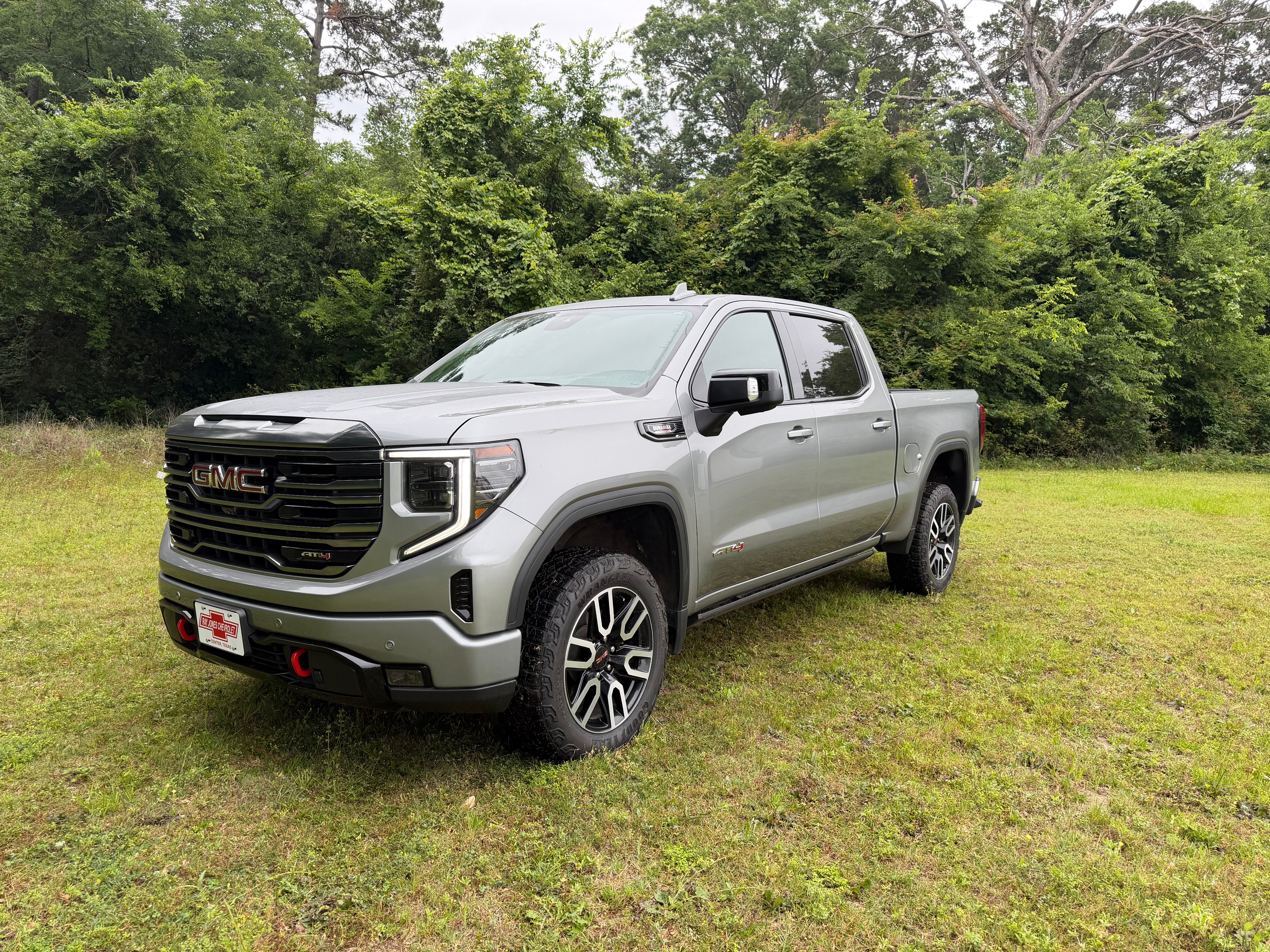 2023 GMC Sierra 1500 AT4 in Sterling Metallic — front three-quarter view